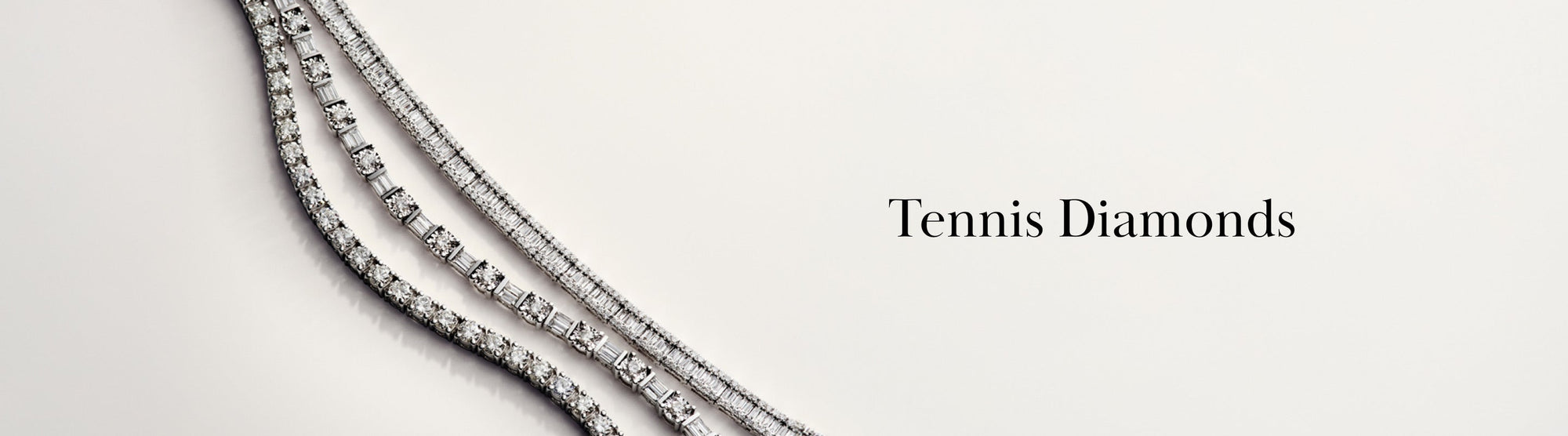 Three sparkling diamond tennis necklaces are arranged diagonally on a light background, with the words Tennis Diamonds in elegant black text on the right side.