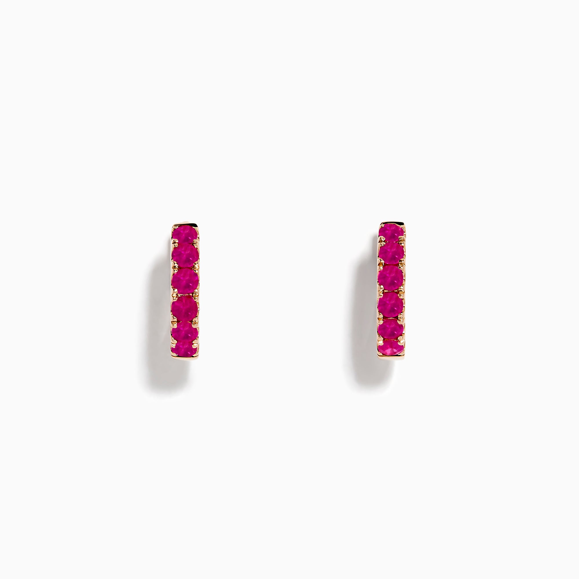 14K Rose Gold Pink Sapphire Huggie Earrings, featuring five vibrant pink sapphires in a vertical row on each small earring, are shown against a plain white background.
