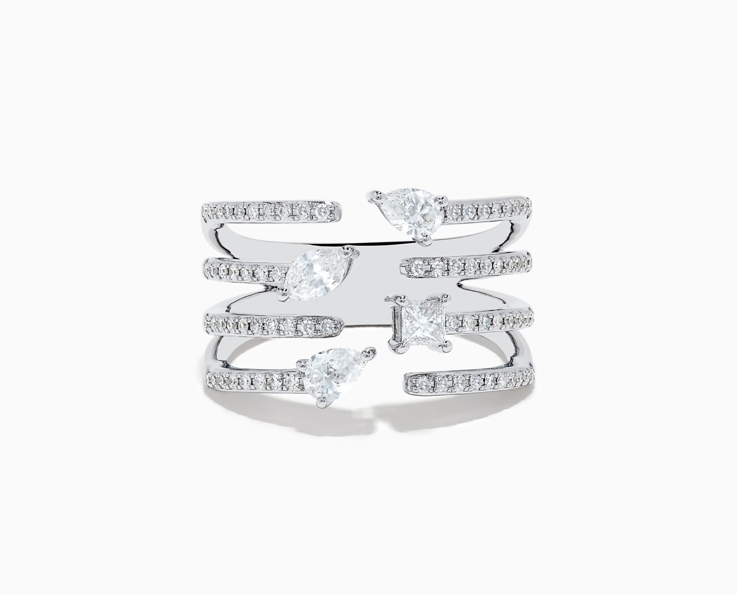 A multi-band silver ring featuring four large gemstones of varying shapes—pear, marquise, and princess-cut—set among smaller round stones on each band against a white background.