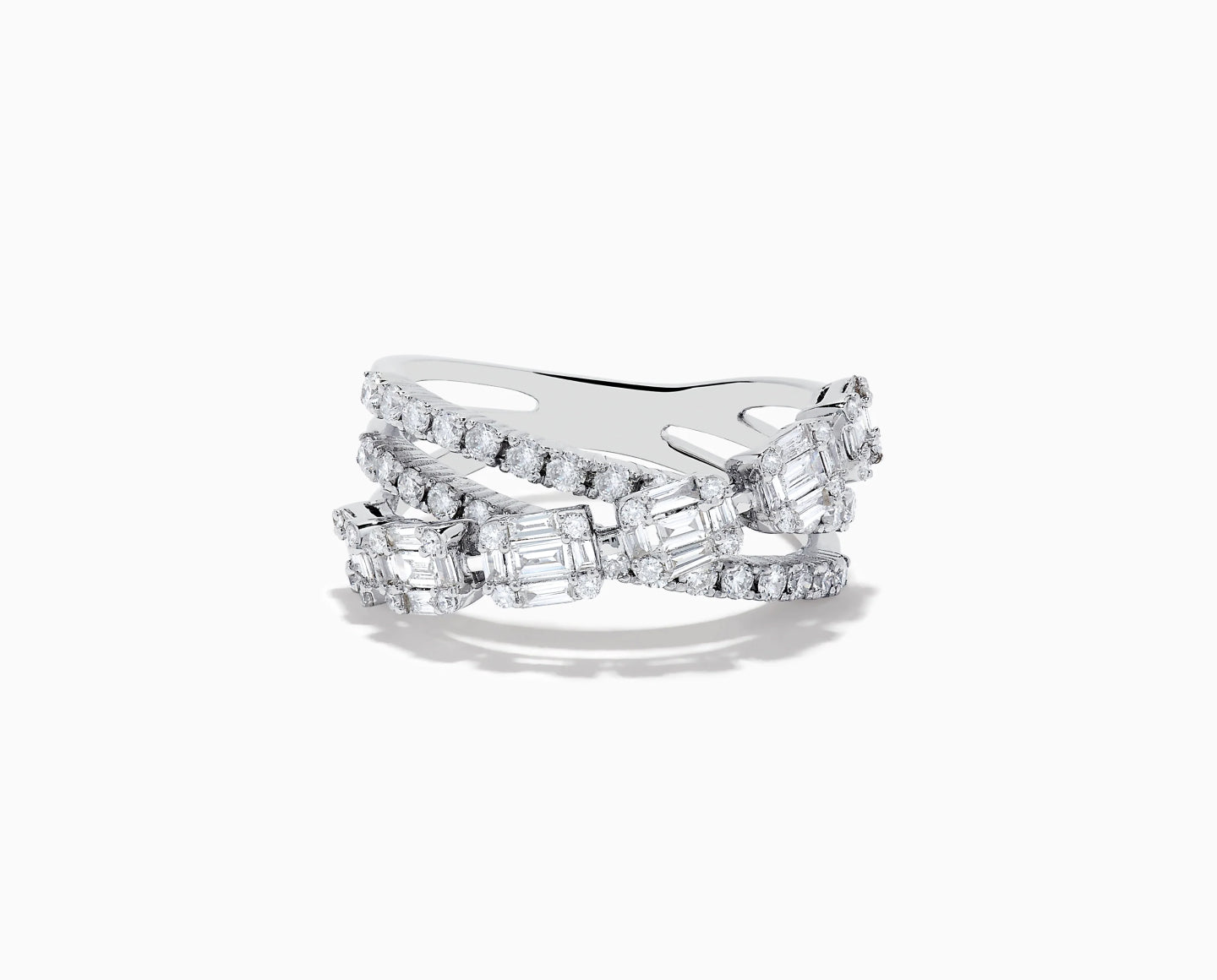 A silver ring with three crisscrossing bands, each adorned with rectangular and round-cut clear gemstones, set against a white background.